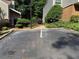 Paved parking area of townhome with landscaping at 40 Dunwoody Springs Dr, Atlanta, GA 30328