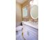 Bright bathroom featuring white marbled floors and modern fixtures at 6494 Bimini Dr, Forest Park, GA 30297
