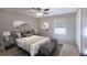 Comfortable bedroom featuring carpet floors and a large window bringing in natural light at 6494 Bimini Dr, Forest Park, GA 30297