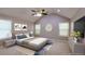 Spacious bedroom with vaulted ceiling, ceiling fan, large windows, and modern decor at 6494 Bimini Dr, Forest Park, GA 30297