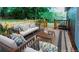 Relaxing outdoor deck area with cozy seating and a stylish rug at 6494 Bimini Dr, Forest Park, GA 30297