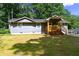 Charming single-story home with a welcoming covered porch and well-maintained front yard at 6494 Bimini Dr, Forest Park, GA 30297