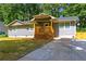 Inviting home with a covered front porch and a paved driveway, perfect for a growing Gathering at 6494 Bimini Dr, Forest Park, GA 30297