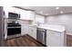 Bright kitchen area with stainless appliances, tile backsplash, and modern faucet at 6494 Bimini Dr, Forest Park, GA 30297