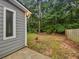 Spacious backyard featuring a privacy fence and lots of trees at 8332 Mountain Pass, Riverdale, GA 30274