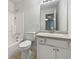 Bathroom features a vanity, mirror, and combined tub and shower at 8332 Mountain Pass, Riverdale, GA 30274