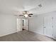 Spacious bedroom featuring a ceiling fan and multiple closets at 8332 Mountain Pass, Riverdale, GA 30274