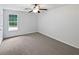 Bright bedroom featuring a ceiling fan and a window at 8332 Mountain Pass, Riverdale, GA 30274