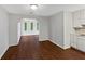 Dining area with wood floors and a view into another room at 8332 Mountain Pass, Riverdale, GA 30274