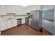 Spacious kitchen with white cabinets and stainless steel appliances at 8332 Mountain Pass, Riverdale, GA 30274