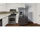 Well-equipped kitchen with stainless steel appliances and white cabinetry at 8332 Mountain Pass, Riverdale, GA 30274
