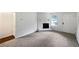 Bright living room features a fireplace and new carpet at 8332 Mountain Pass, Riverdale, GA 30274