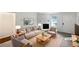 Cozy staged living room with neutral colors, a fireplace, and ample seating area at 8332 Mountain Pass, Riverdale, GA 30274