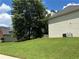 A large grassy backyard with mature trees at 1055 Havenstone Walk, Lawrenceville, GA 30045