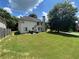 A spacious backyard featuring a patio set and a lush lawn at 1055 Havenstone Walk, Lawrenceville, GA 30045