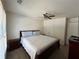 Bedroom with a queen size bed, nightstands, closet and ceiling fan providing a relaxing space at 1055 Havenstone Walk, Lawrenceville, GA 30045