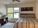 Bedroom with large windows, natural light, and comfortable bed at 1055 Havenstone Walk, Lawrenceville, GA 30045