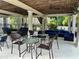 Outdoor community space featuring ceiling fans, comfortable seating, and tables for relaxing and socializing at 1055 Havenstone Walk, Lawrenceville, GA 30045