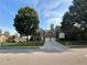 Beautiful brick home with a well-manicured lawn, mature trees, and a two car garage at 1055 Havenstone Walk, Lawrenceville, GA 30045