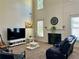 Spacious living room with high ceilings, a fireplace, and comfortable seating area at 1055 Havenstone Walk, Lawrenceville, GA 30045