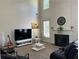 A bright living room with large windows and a fireplace at 1055 Havenstone Walk, Lawrenceville, GA 30045