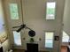Spacious living room featuring high ceilings, a fireplace, and an abundance of windows for natural light at 1055 Havenstone Walk, Lawrenceville, GA 30045