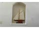 A decorative niche featuring a model sailboat at 1055 Havenstone Walk, Lawrenceville, GA 30045