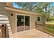 Wooden back deck with sliding glass doors to the house overlooking the back yard at 135 Buckhurst Way, Atlanta, GA 30349