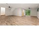 Finished basement with wood floors and access to the backyard at 135 Buckhurst Way, Atlanta, GA 30349
