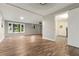 Finished basement with wood floors, natural light, and neutral paint at 135 Buckhurst Way, Atlanta, GA 30349