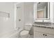 Modern bathroom featuring white subway tile, granite countertop, and updated fixtures at 135 Buckhurst Way, Atlanta, GA 30349
