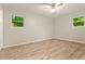 Spacious bedroom featuring wood floors, neutral paint, and natural light at 135 Buckhurst Way, Atlanta, GA 30349