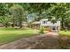 A charming split-level house with well-manicured lawn and garden at 135 Buckhurst Way, Atlanta, GA 30349