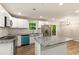 Bright kitchen featuring white cabinets, stainless steel appliances, and granite countertops at 135 Buckhurst Way, Atlanta, GA 30349