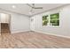 Bright living room featuring modern wood floors, neutral paint, and ample natural light at 135 Buckhurst Way, Atlanta, GA 30349