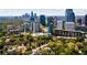 A partial aerial view showing the skyline and dense tree canopy of the city at 145 15Th Ne St # 1209, Atlanta, GA 30309