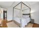 Spacious bedroom featuring a four-poster bed and ample natural light at 145 15Th Ne St # 1209, Atlanta, GA 30309