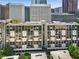 A full exterior view of a high-rise apartment building at 145 15Th Ne St # 1209, Atlanta, GA 30309