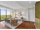 Cozy living room showcasing a full wall of windows with picturesque outdoor views at 145 15Th Ne St # 1209, Atlanta, GA 30309