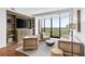Bright and airy living room featuring built-in shelves and an expansive view at 145 15Th Ne St # 1209, Atlanta, GA 30309