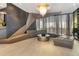 The condo lobby features stylish seating, gray accent wall, and modern chandelier at 145 15Th Ne St # 1209, Atlanta, GA 30309