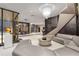Condo lobby with modern seating, chandelier, tile floor, and access to other lobby areas at 145 15Th Ne St # 1209, Atlanta, GA 30309