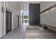 Hallway with elevators, contemporary light fixtures, wood bench seating and decorative wall art at 145 15Th Ne St # 1209, Atlanta, GA 30309