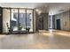 View of the building lobby featuring neutral tiling, a decorative sculpture, plants, seating, and elevators at 145 15Th Ne St # 1209, Atlanta, GA 30309