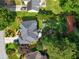 Aerial view of a charming home with a well-maintained yard and lush greenery at 1490 Rivershyre Pkwy, Lawrenceville, GA 30043