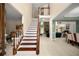Spacious foyer featuring a staircase and views of the living and dining areas at 1490 Rivershyre Pkwy, Lawrenceville, GA 30043