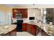 Beautiful kitchen featuring granite countertops, tile backsplash, and stainless steel appliances at 1490 Rivershyre Pkwy, Lawrenceville, GA 30043