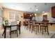 Bright kitchen boasts custom cabinetry, granite countertops, and a cozy breakfast bar at 1490 Rivershyre Pkwy, Lawrenceville, GA 30043