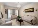 Elegant living room with white furniture, large windows, and a chandelier at 1490 Rivershyre Pkwy, Lawrenceville, GA 30043