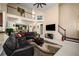 Comfortable living area with a fireplace, contemporary furnishings, and lots of natural light at 1490 Rivershyre Pkwy, Lawrenceville, GA 30043